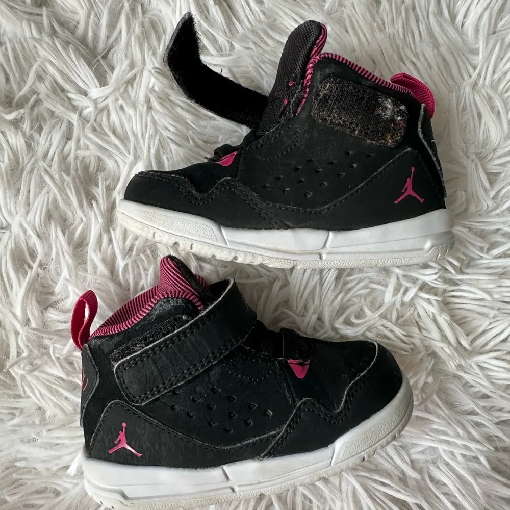 Nike Flight Jordan’s pink and black high top sneakers size 5c